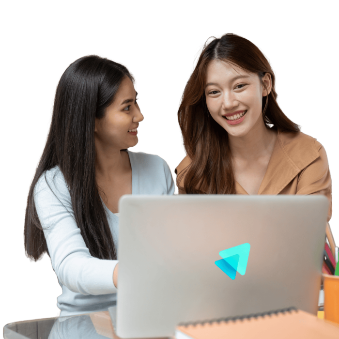 two women discussing in front of computure with smile face.